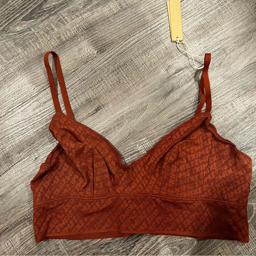 SKIMS logo triangle bralette